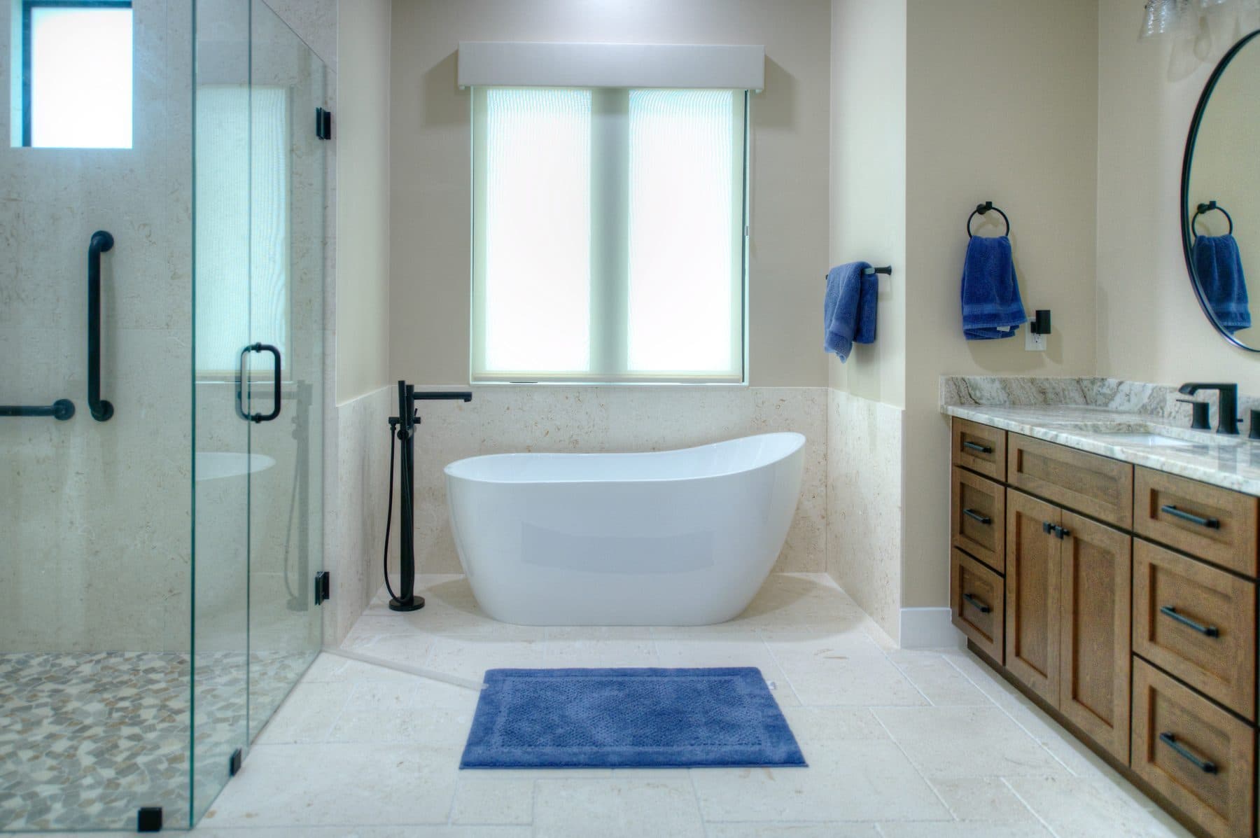 Spa-style bathroom with soaking tub and glass shower