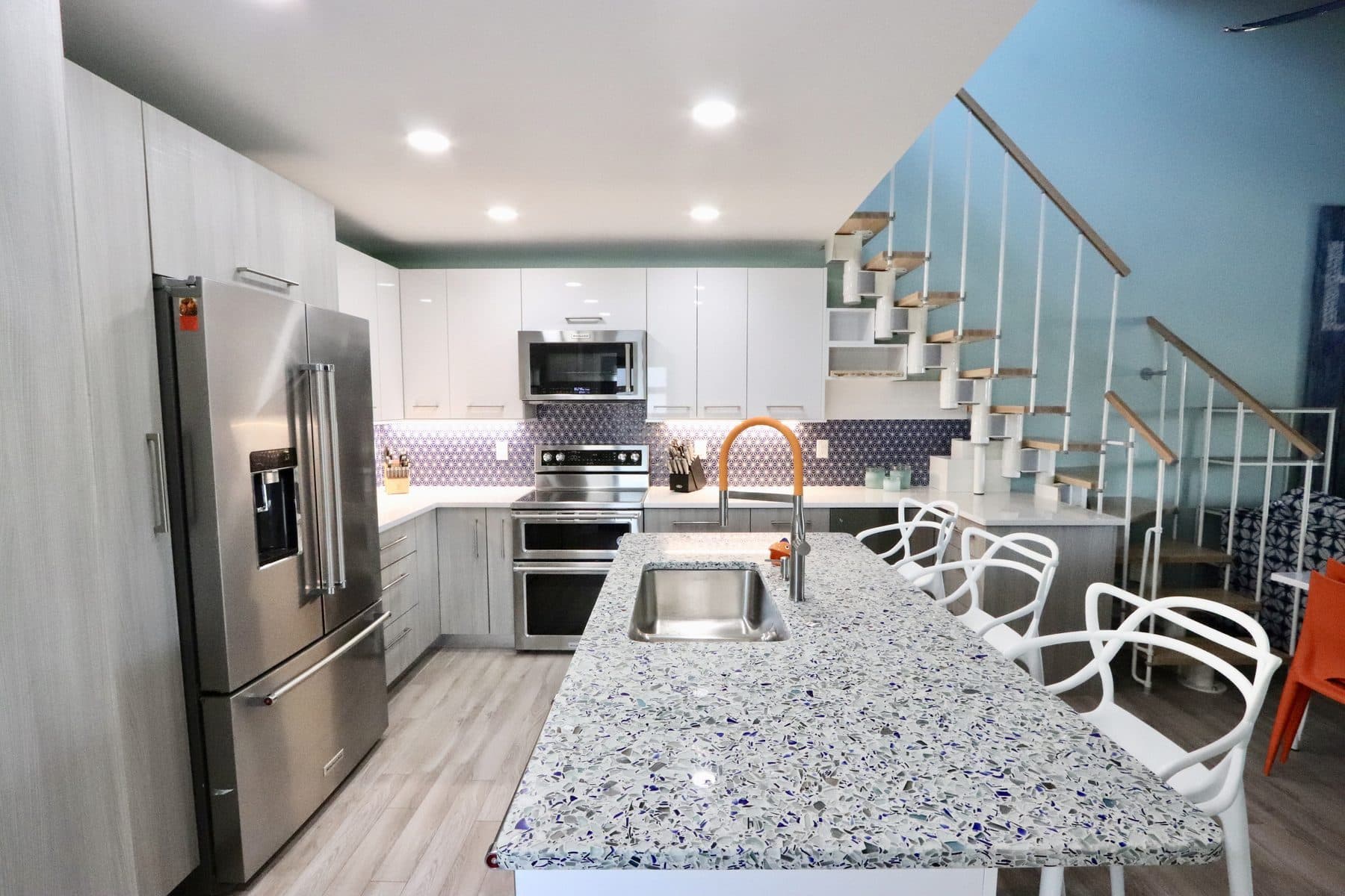 Open kitchen with a spiral staircase feature