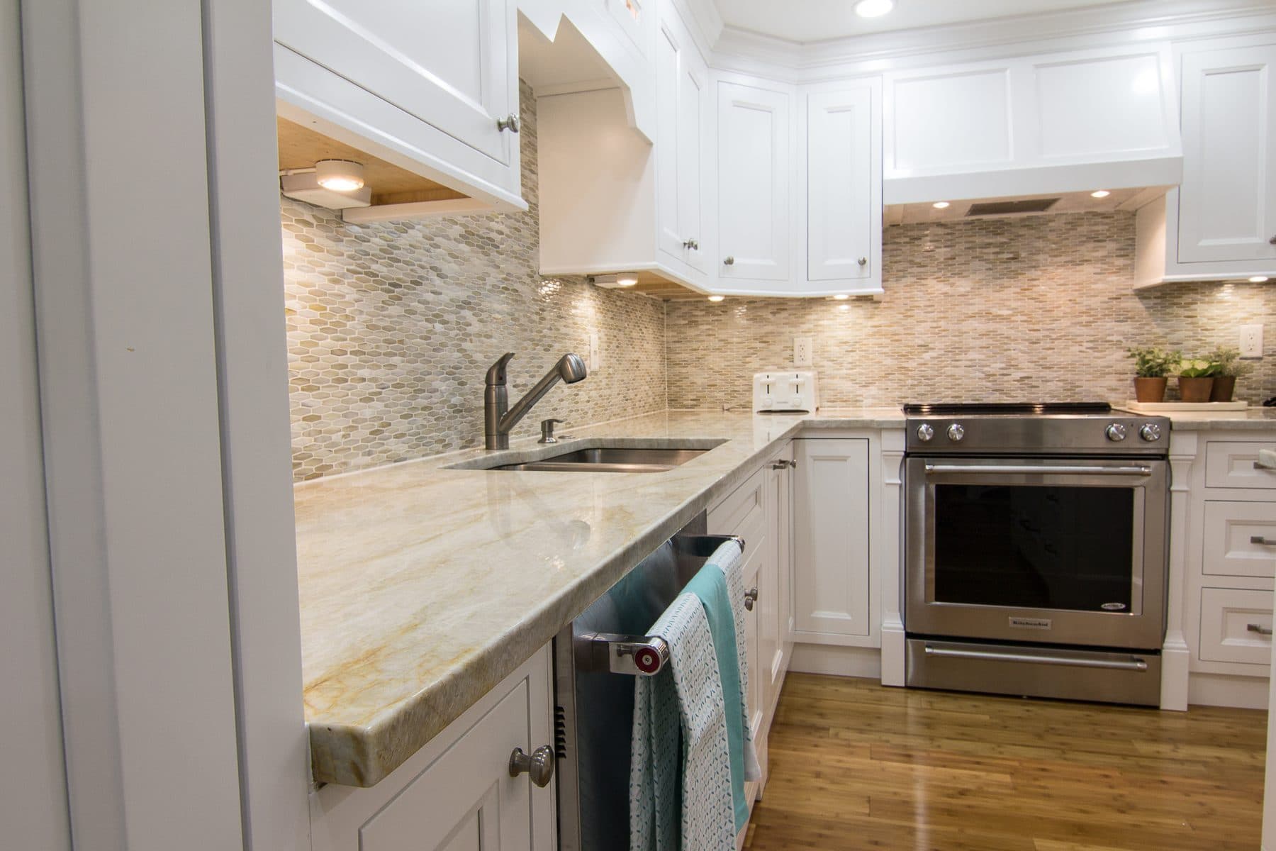 Transitional kitchen with white cabinets and subway tile